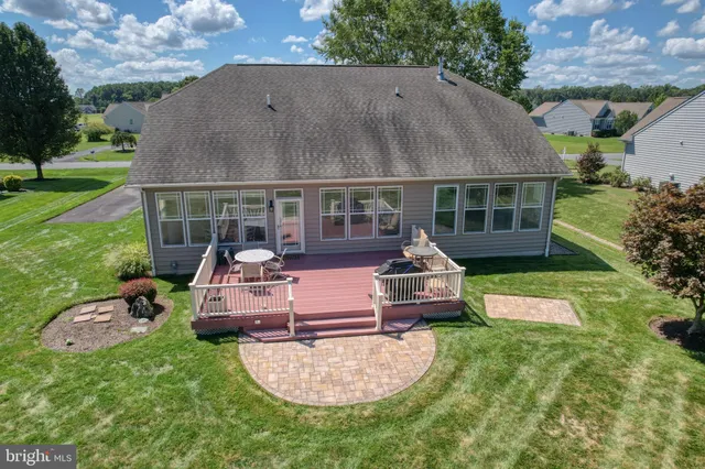 a front view of a house with a garden and porch