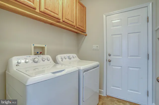 a view of a livingroom with furniture and a flat screen tv