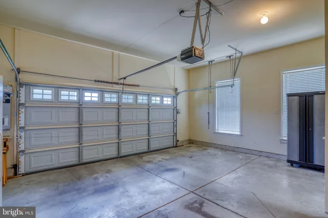 an aerial view of a house with a swimming pool a yard and lake view