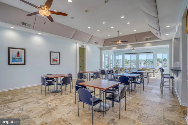 a view of a cars park in front of a building