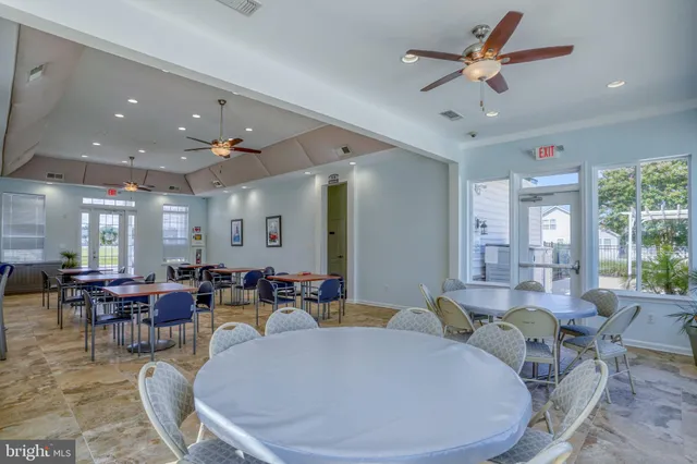 a view of path along with retail shop and outdoor seating