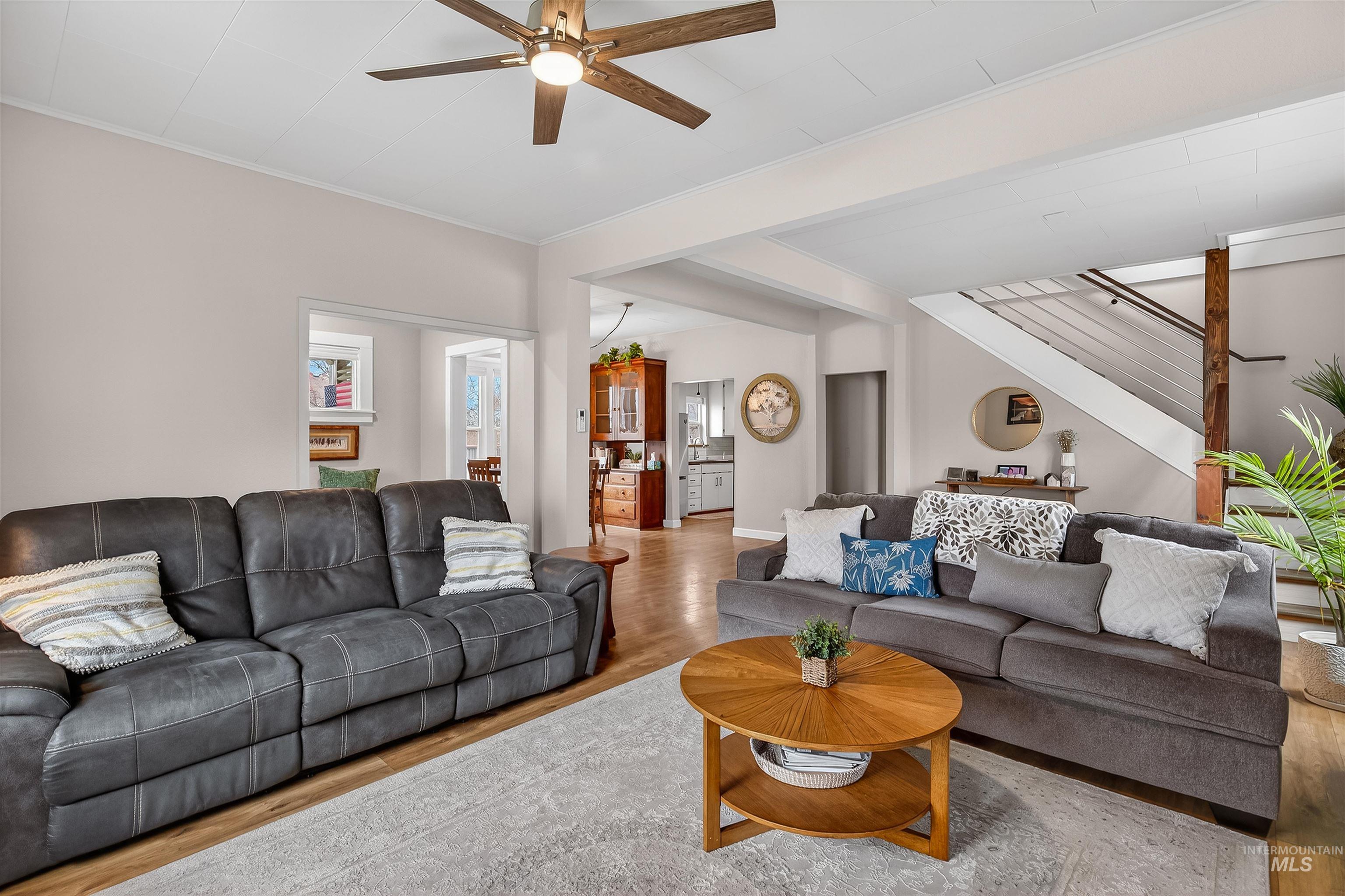 716 Chestnut Street Clarkston, WA 99403 - Photo 17 of 49 Living area with wood finished floors, ceiling fan, and ornamental molding