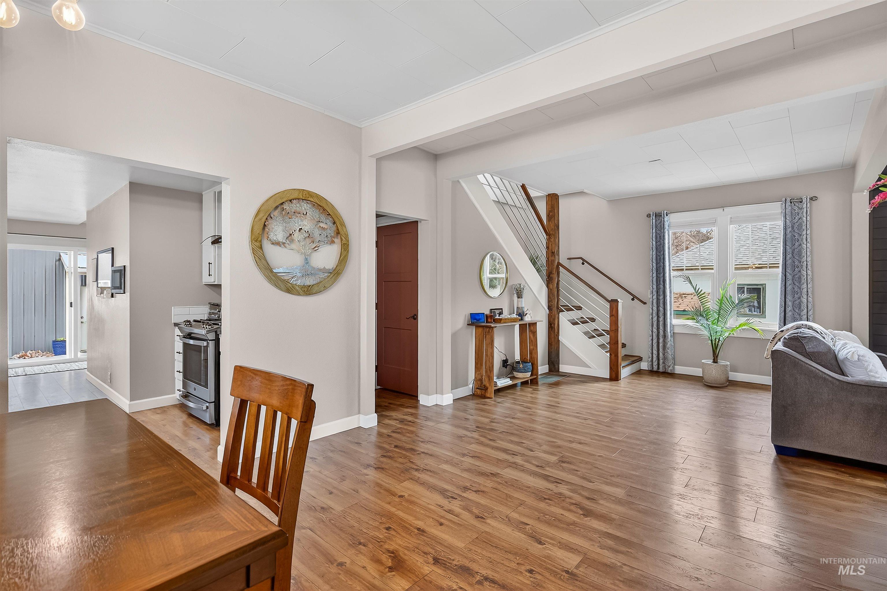716 Chestnut Street Clarkston, WA 99403 - Photo 19 of 49 Dining area with light wood finished floors and ornamental molding