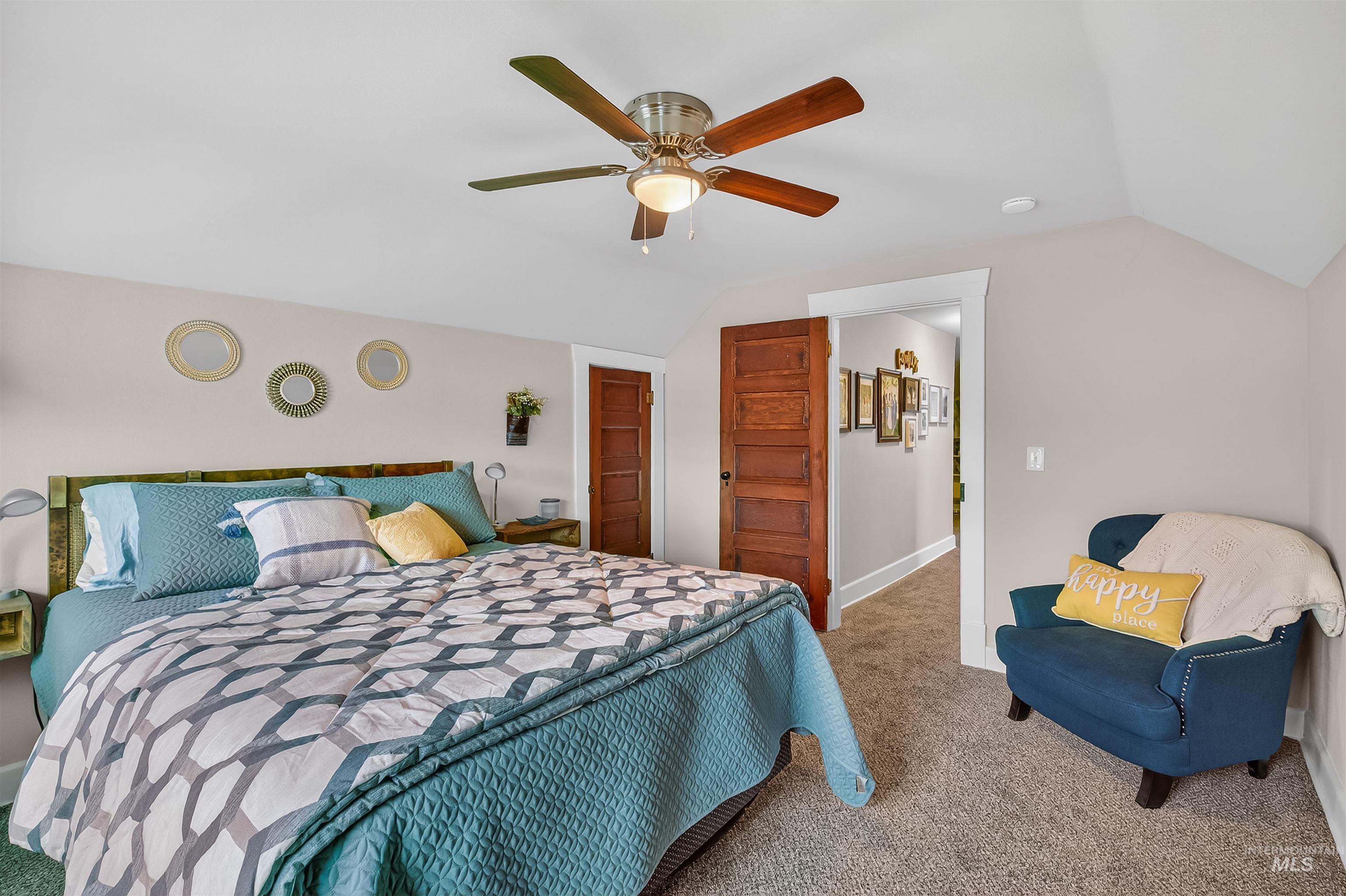 716 Chestnut Street Clarkston, WA 99403 - Photo 27 of 49 Carpeted bedroom with vaulted ceiling and ceiling fan