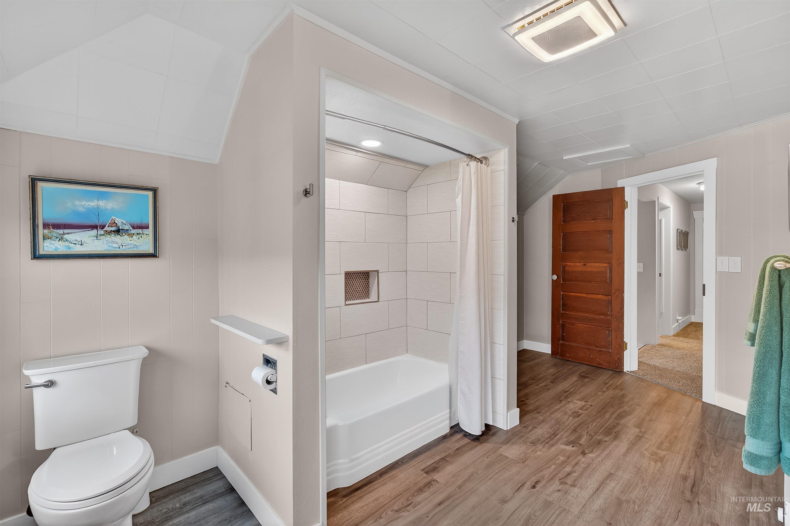 716 Chestnut Street Clarkston, WA 99403 - Photo 38 of 49 Bathroom with light wood-type flooring and shower / bath combo with shower curtain