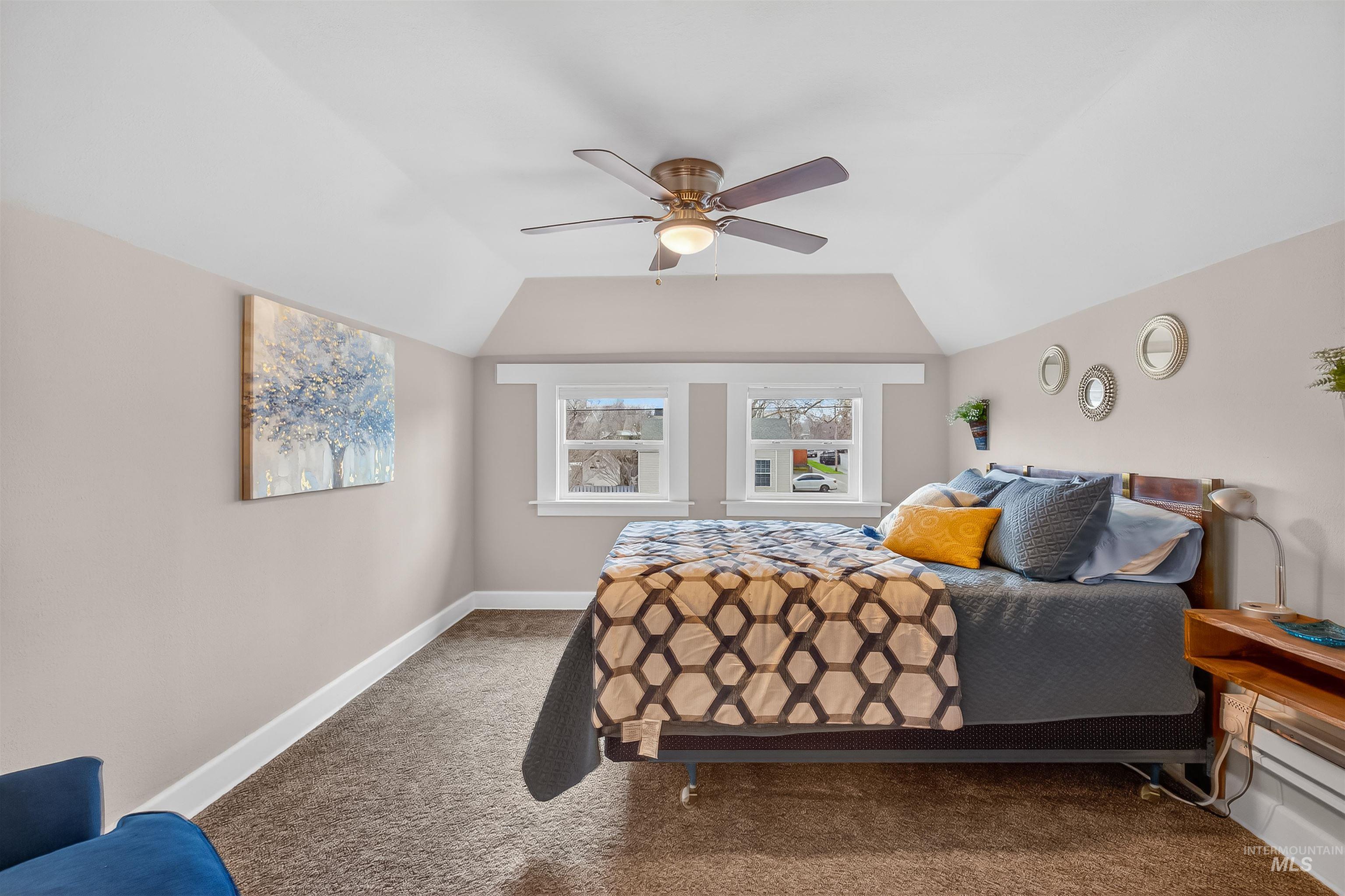 716 Chestnut Street Clarkston, WA 99403 - Photo 42 of 49 Carpeted bedroom featuring vaulted ceiling and ceiling fan