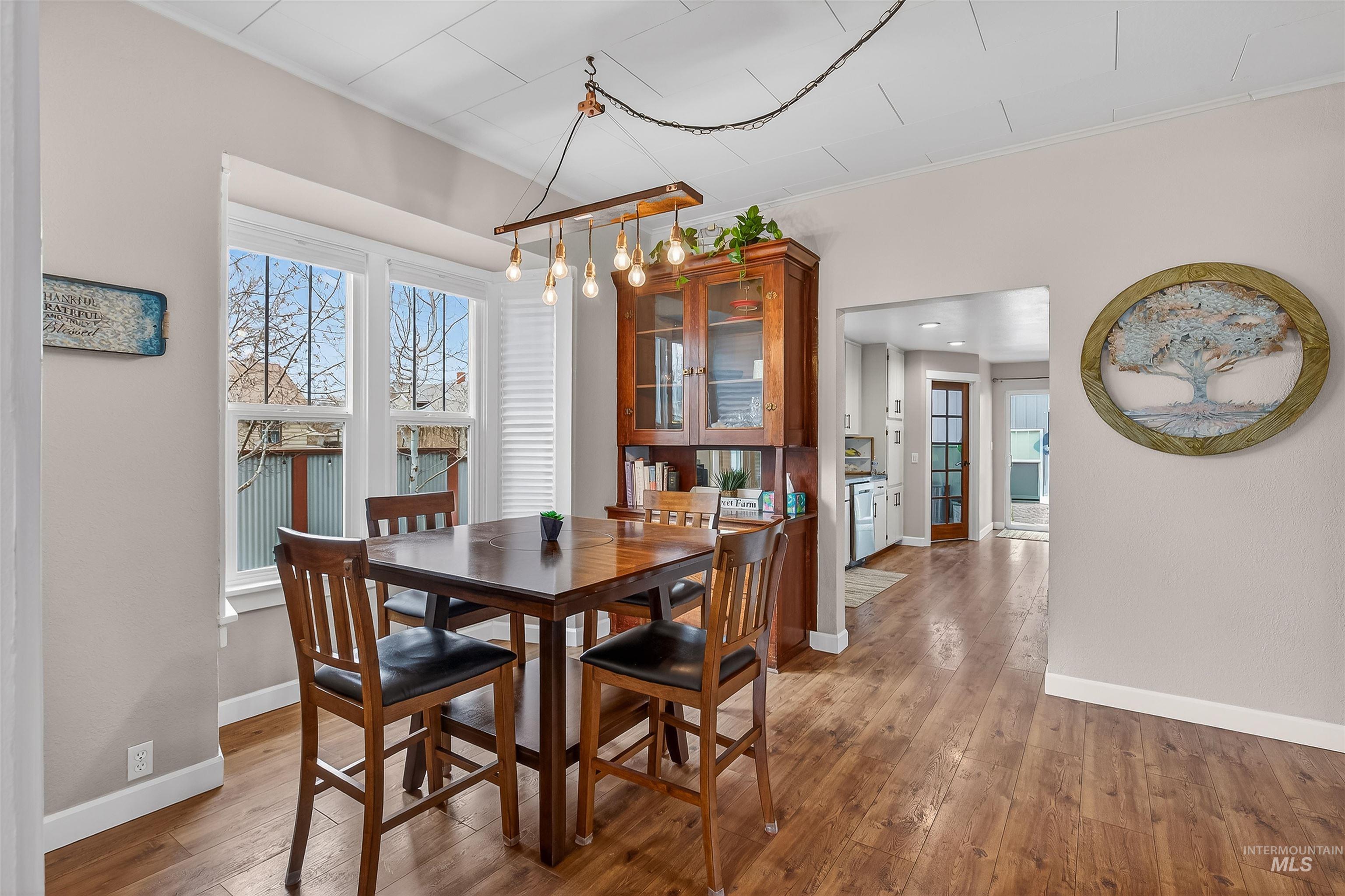 716 Chestnut Street Clarkston, WA 99403 - Photo 7 of 49 Dining room featuring light wood-type flooring and ornamental molding
