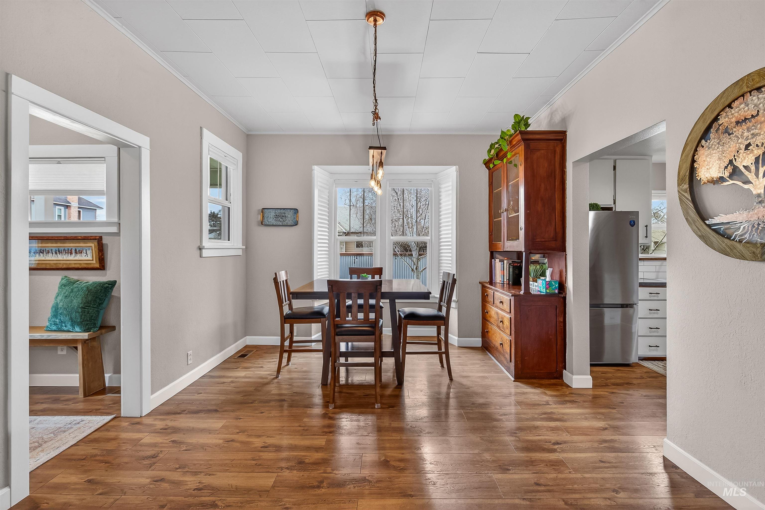 716 Chestnut Street Clarkston, WA 99403 - Photo 10 of 49 Dining area featuring light wood-style flooring and ornamental molding