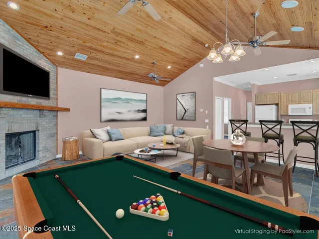 a living room with fireplace furniture and a flat screen tv