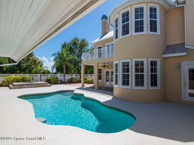 a view of a house with a swimming pool
