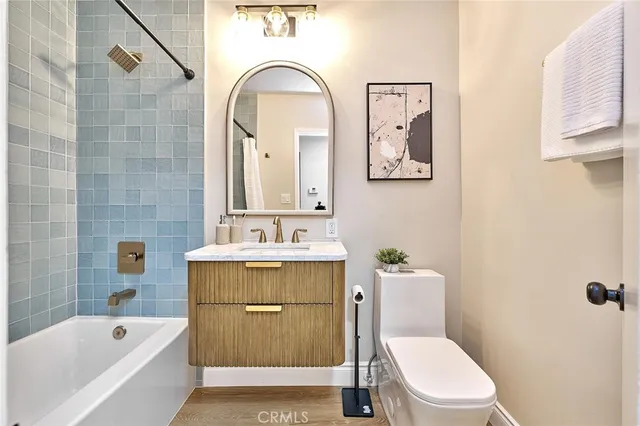 a bathroom with a sink toilet and bathtub