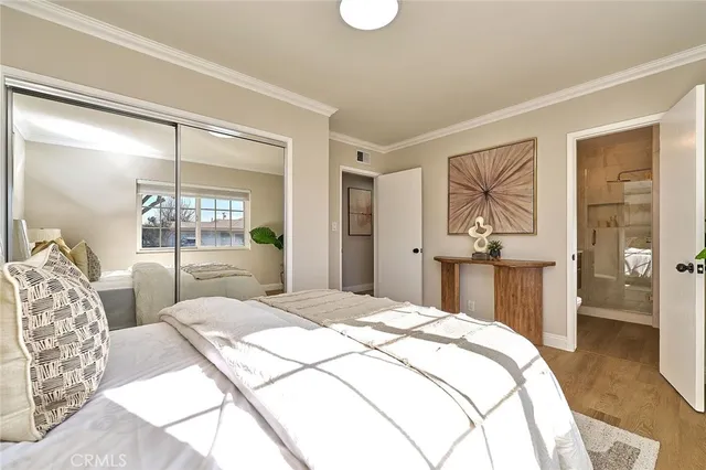 a bedroom with a large bed and a window