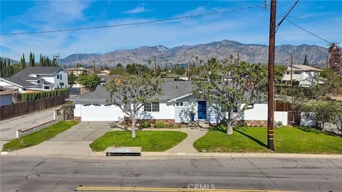 a view of a street with a houses