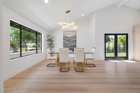 a view of a dining room with furniture window and outside view