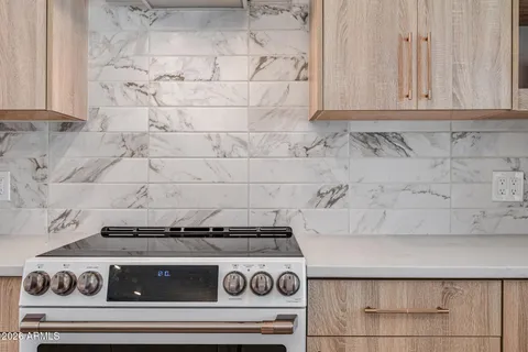 a spacious bathroom with a toilet a sink and bathtub