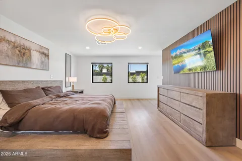 a bedroom with a bed and a fireplace