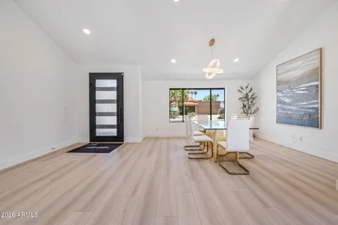 a view of a room with wooden floor and windows
