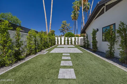 an aerial view of residential houses with city view