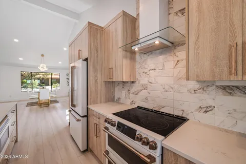 a bathroom with a sink a mirror and a shower