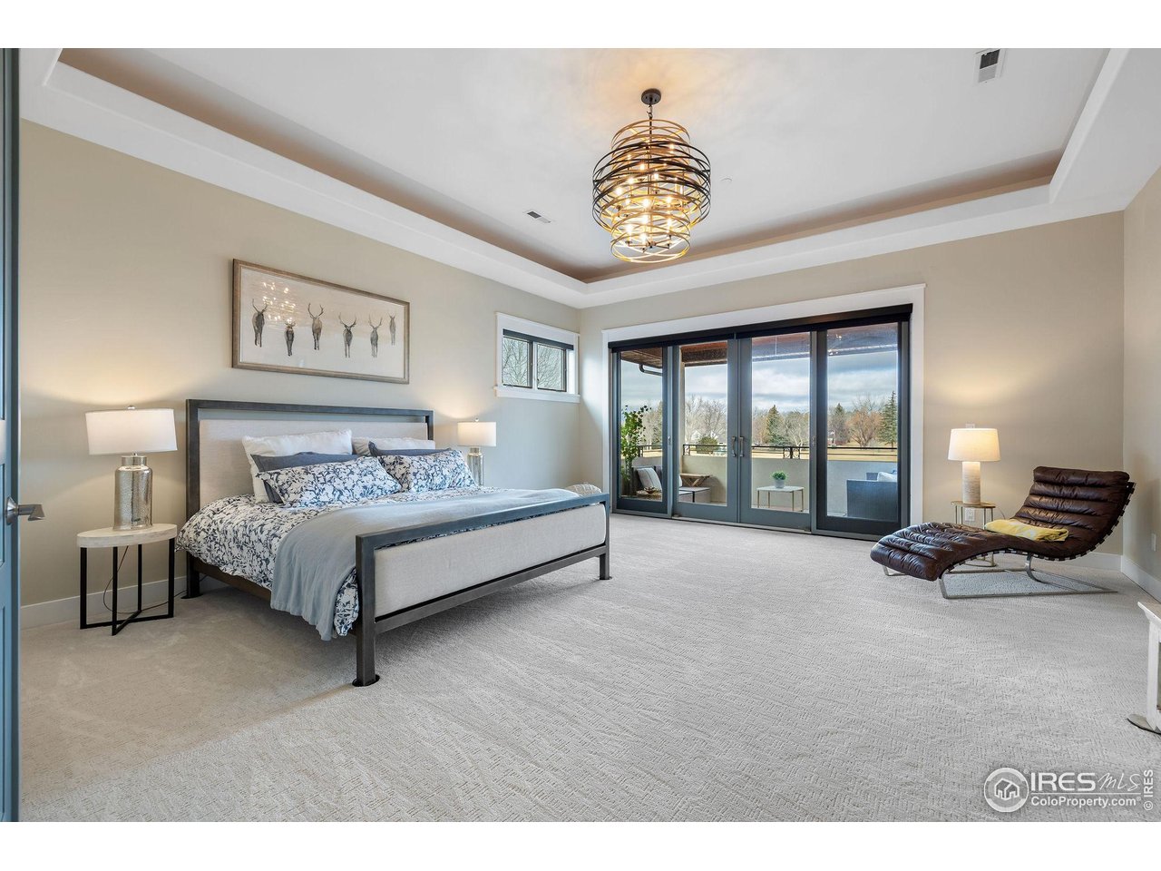 7205 Rustic Trail Boulder, CO 80301 - Photo 27 of 49 a spacious bedroom with a bed and a large window