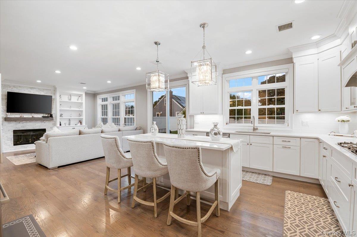 1427 Bellmore Road North Bellmore, NY 11710 - Photo 13 of 38 a large kitchen with a table and chairs