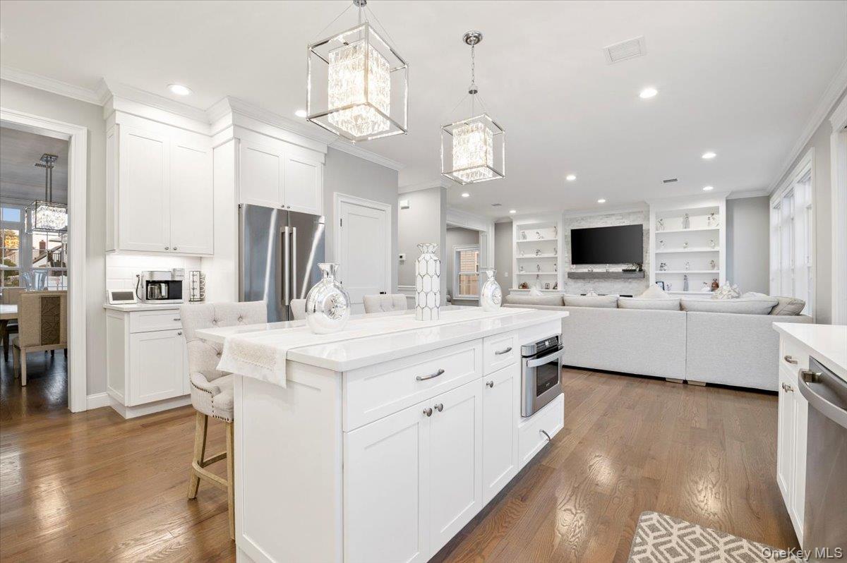 1427 Bellmore Road North Bellmore, NY 11710 - Photo 16 of 38 a large kitchen with cabinets a sink stainless steel appliances and kitchen view