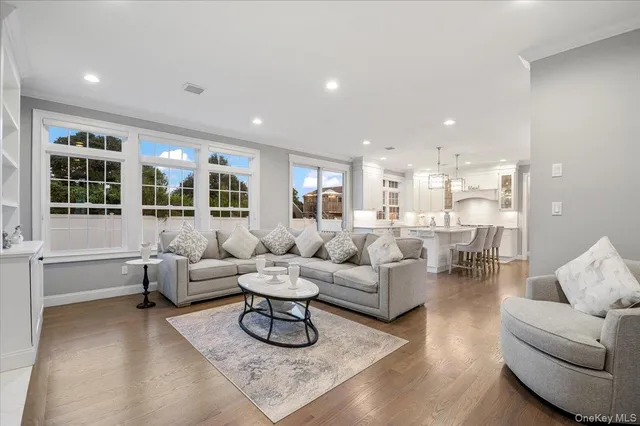 a large kitchen with cabinets a sink stainless steel appliances and kitchen view