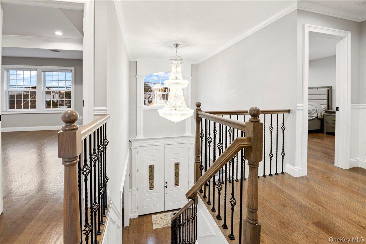 1427 Bellmore Road North Bellmore, NY 11710 - Photo 21 of 38 a view of a hallway with wooden floor and windows