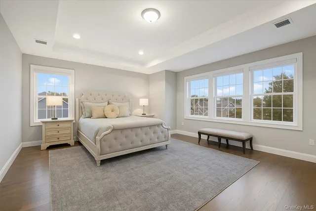 a bathroom with a granite countertop sink a toilet and bathtub