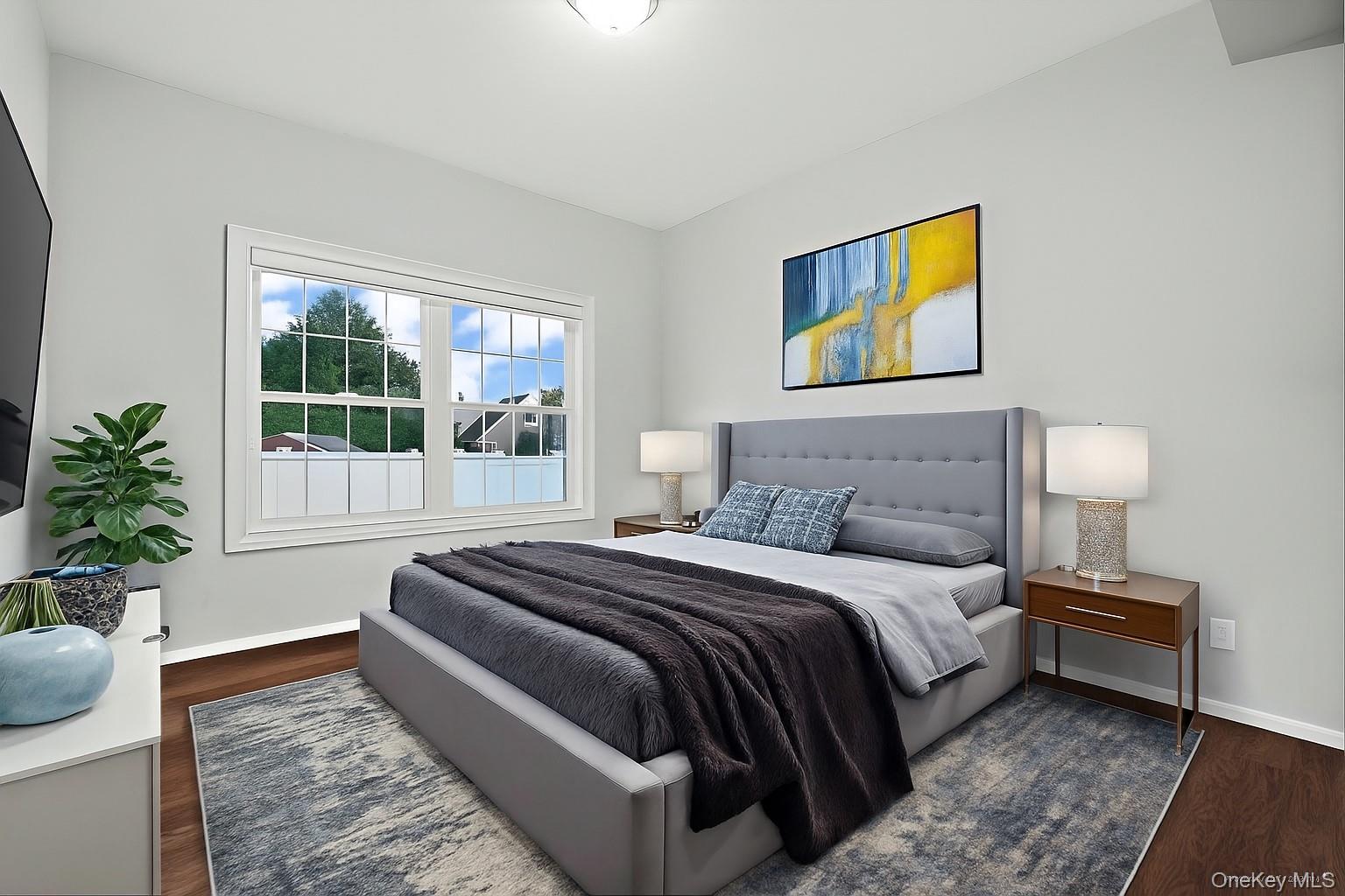 1427 Bellmore Road North Bellmore, NY 11710 - Photo 27 of 38 a bedroom with a bed and a couch