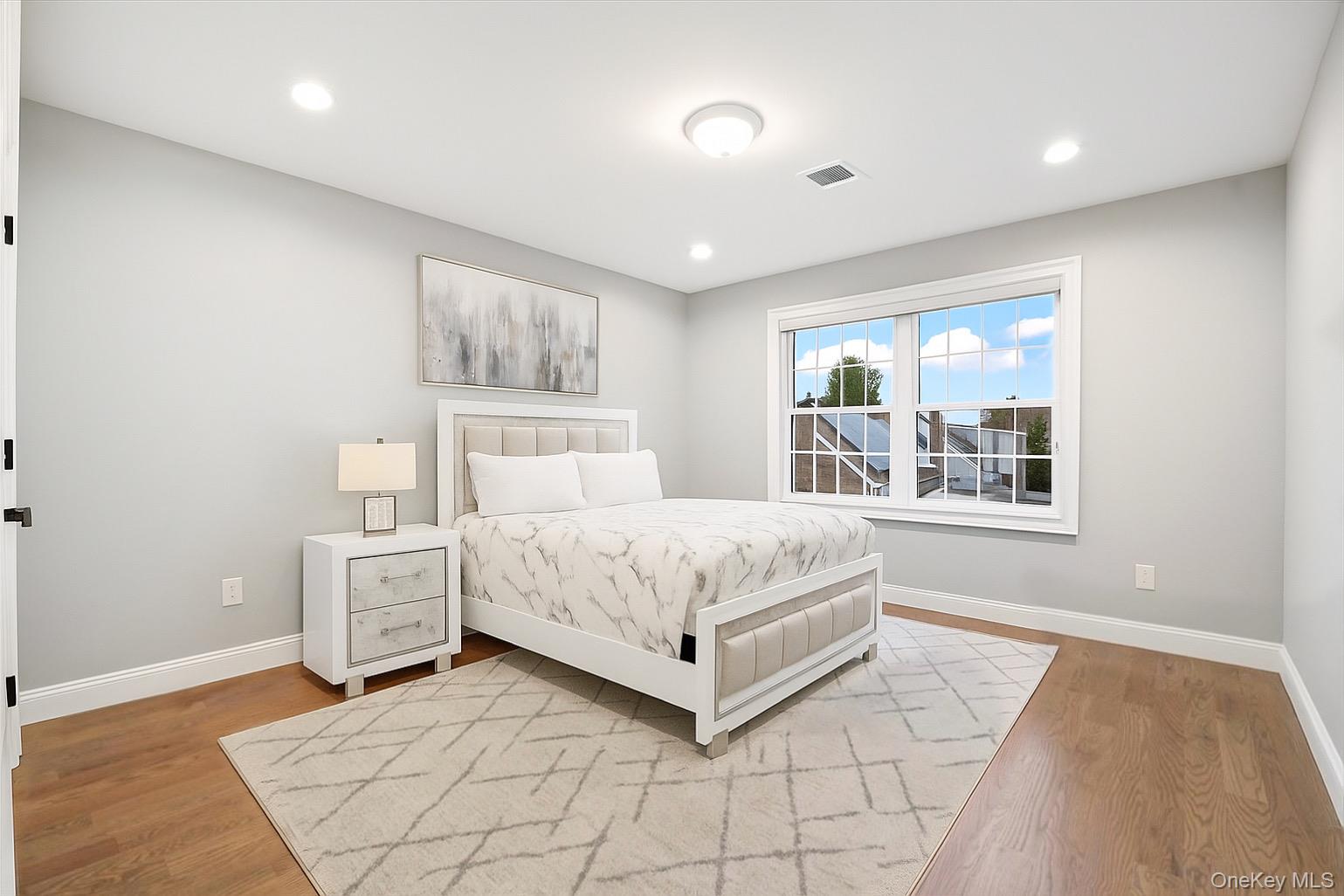 1427 Bellmore Road North Bellmore, NY 11710 - Photo 30 of 38 a bedroom with a bed and a window