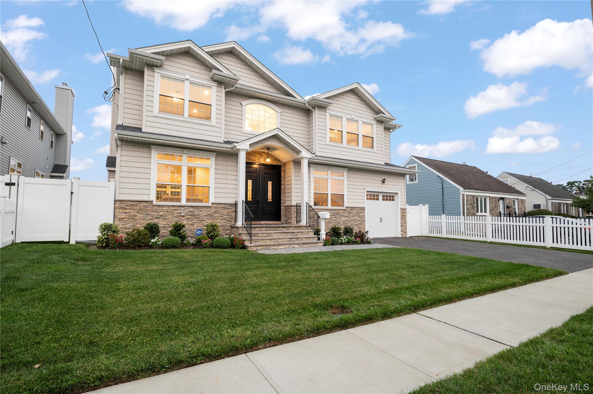 1427 Bellmore Road North Bellmore, NY 11710 - Photo 31 of 38 a front view of a house with a garden