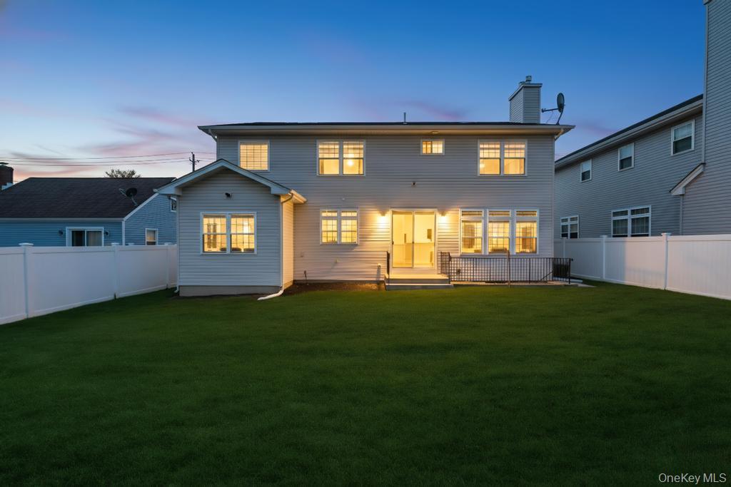 1427 Bellmore Road North Bellmore, NY 11710 - Photo 33 of 38 a front view of a house with a yard