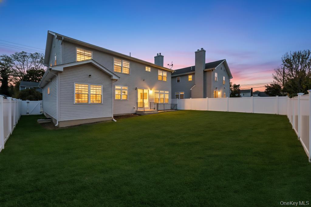1427 Bellmore Road North Bellmore, NY 11710 - Photo 35 of 38 a front view of a house with a garden