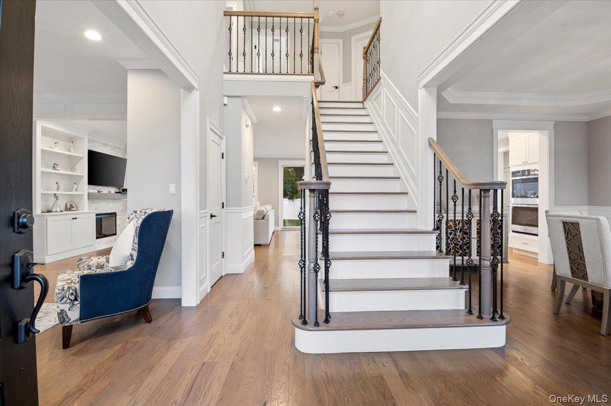 1427 Bellmore Road North Bellmore, NY 11710 - Photo 5 of 38 a view of entryway and hall with wooden floor