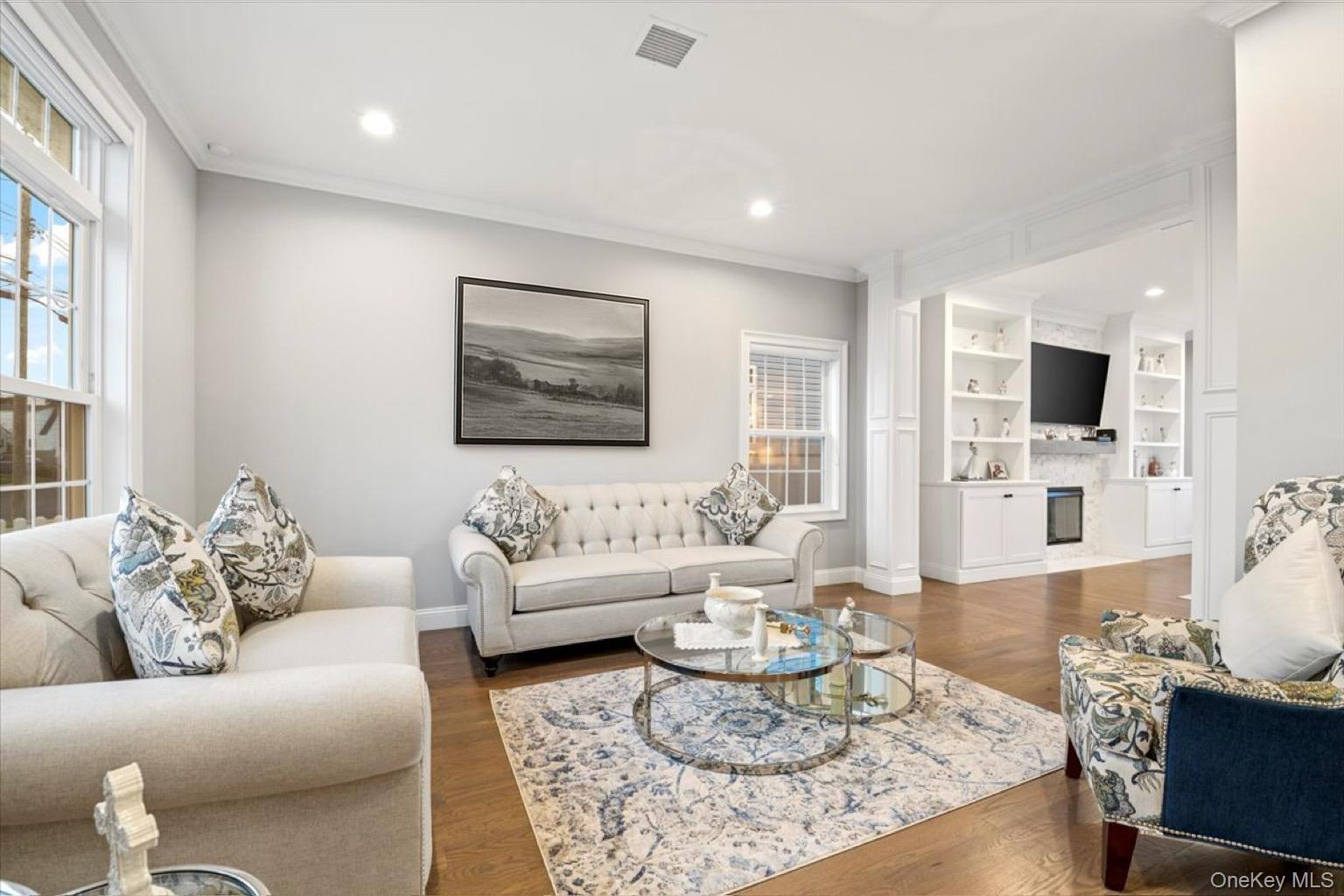 1427 Bellmore Road North Bellmore, NY 11710 - Photo 7 of 38 a living room with furniture and a flat screen tv