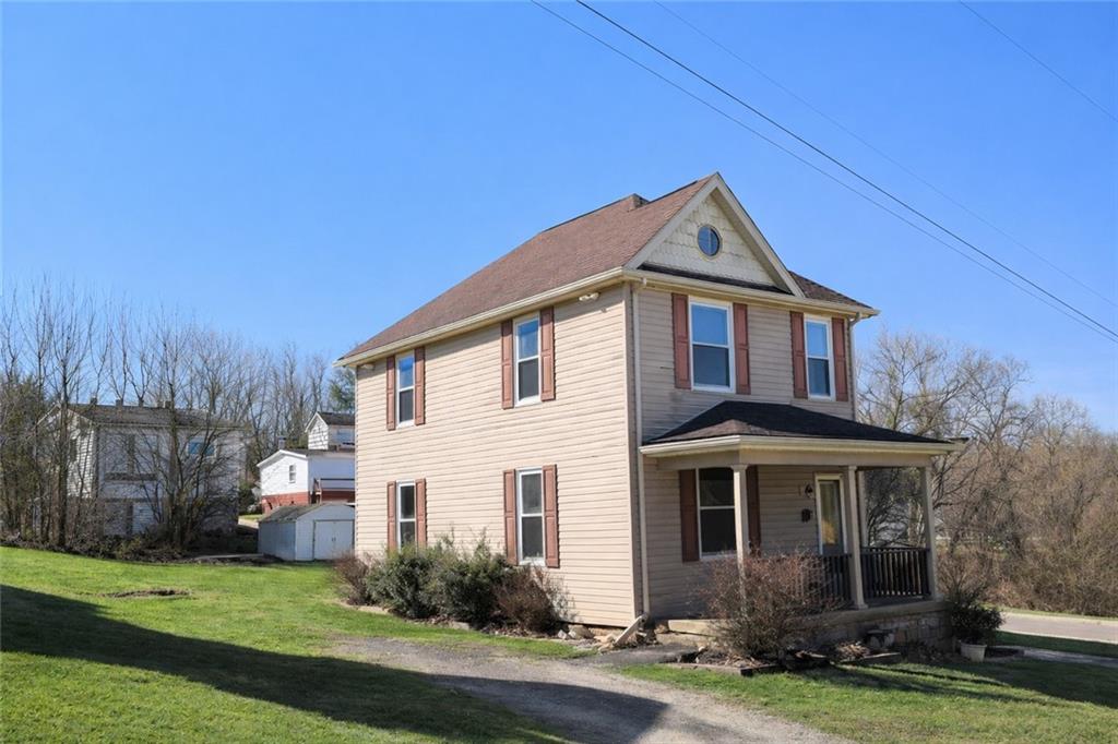 624 Kier Road Salina, PA 15680 - Photo 4 of 19 a front view of a house with a yard and garage