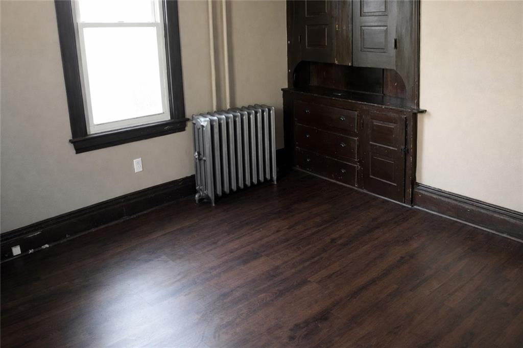 624 Kier Road Salina, PA 15680 - Photo 8 of 19 an empty room with wooden floor and windows