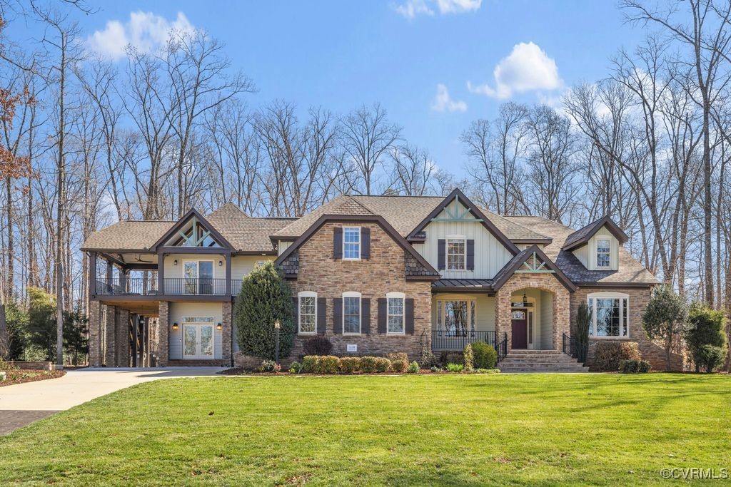 a front view of a building with a garden