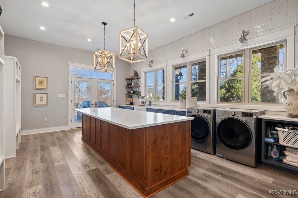 14106 Old Fort Drive Midlothian, VA 23113 - Photo 13 of 47 a large kitchen with stainless steel appliances granite countertop a stove and a wooden floors