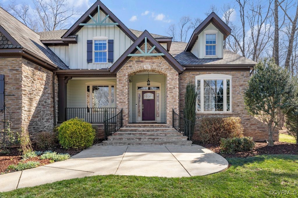 14106 Old Fort Drive Midlothian, VA 23113 - Photo 2 of 47 a front view of a house with garden