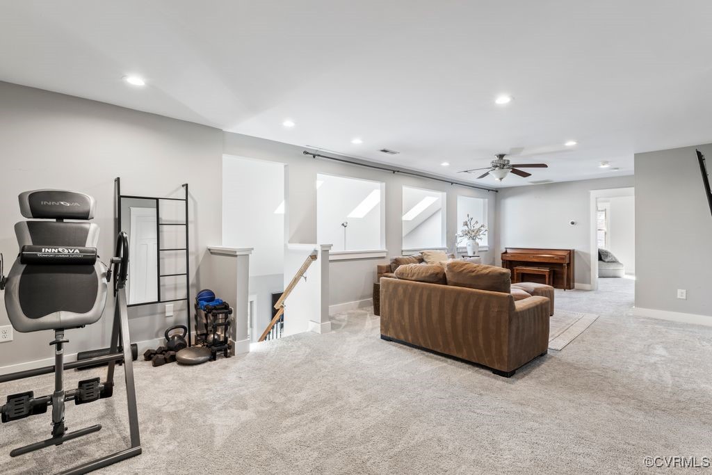 14106 Old Fort Drive Midlothian, VA 23113 - Photo 23 of 47 a living room with furniture a flat screen tv and a large window