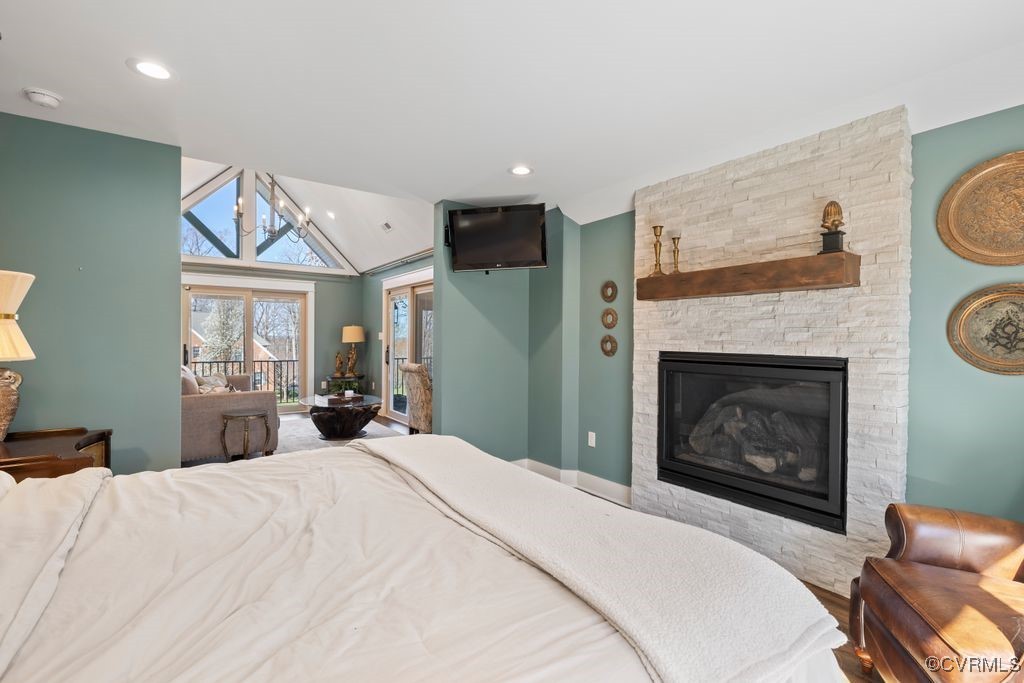 14106 Old Fort Drive Midlothian, VA 23113 - Photo 33 of 47 a bedroom with a bed and fireplace with mirror