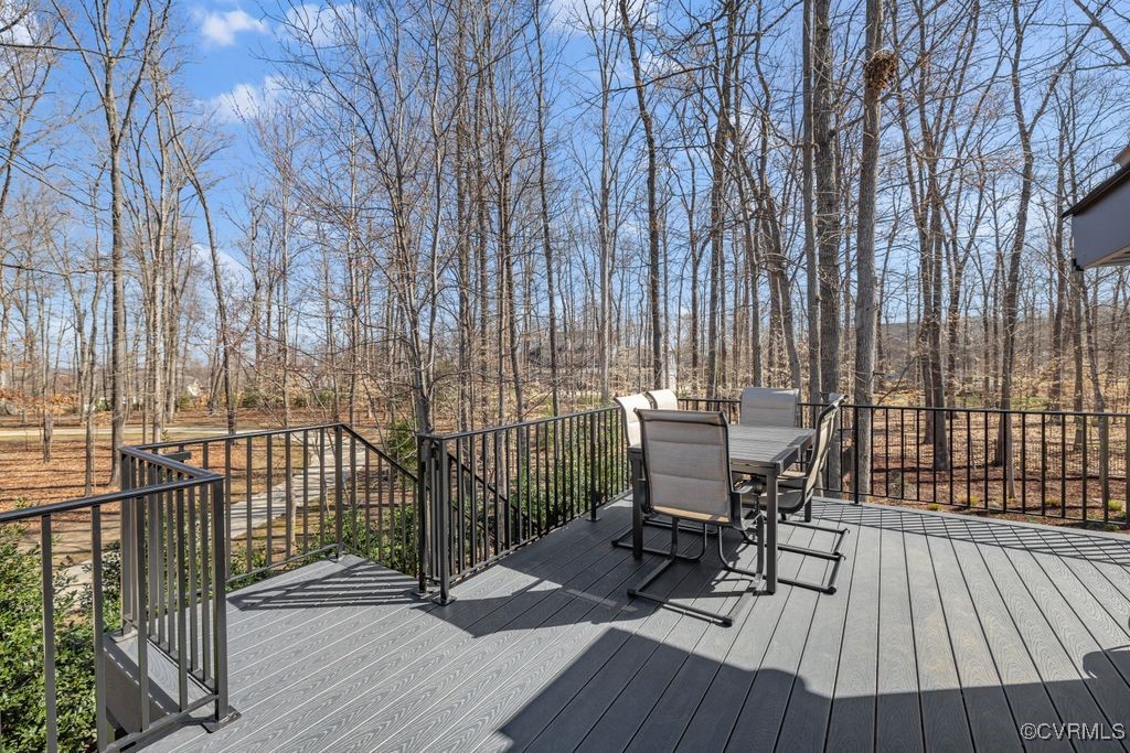 14106 Old Fort Drive Midlothian, VA 23113 - Photo 38 of 47 a view of a patio with table and chairs and wooden floor