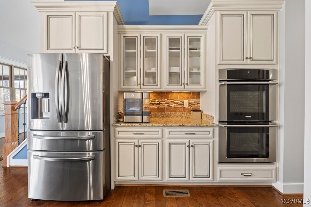 14106 Old Fort Drive Midlothian, VA 23113 - Photo 10 of 47 a kitchen with stainless steel appliances granite countertop a refrigerator and a stove top oven