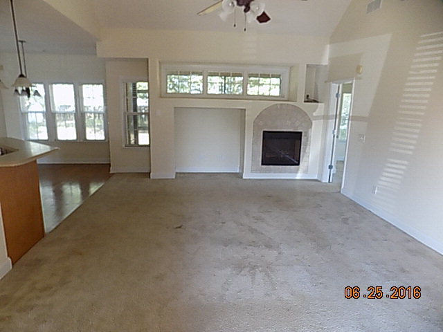 218 Timber Ridge Boulevard Byron, GA 31008 - Photo 5 of 30 a view of an empty room with a fireplace and a window