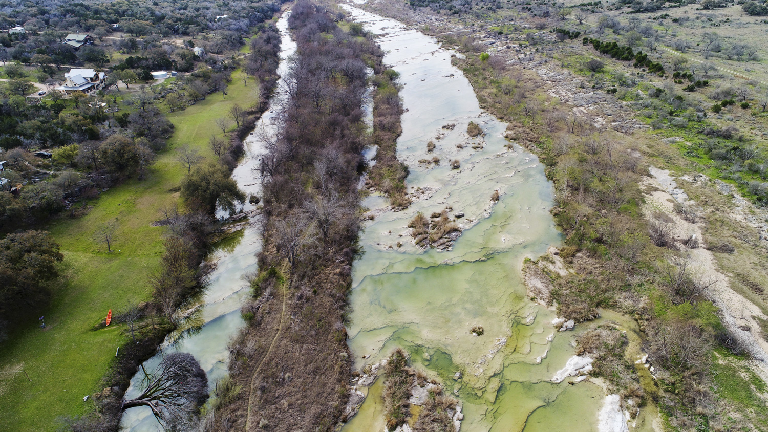 a aerial view of a house with a yard