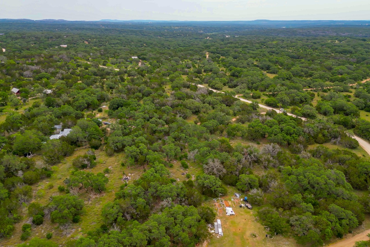 1365 Pedernales Hills Road Johnson City, TX 78636 - Photo 23 of 31 a view of a green field with lots of bushes