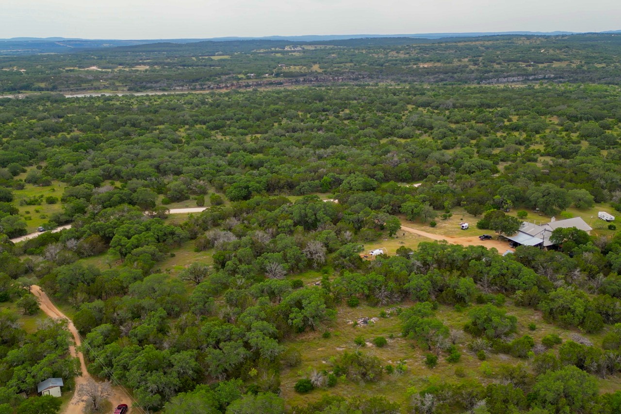 1365 Pedernales Hills Road Johnson City, TX 78636 - Photo 25 of 31 a view of a lush green forest with lush green forest