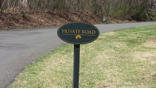 a view of a wooden door with a sign board